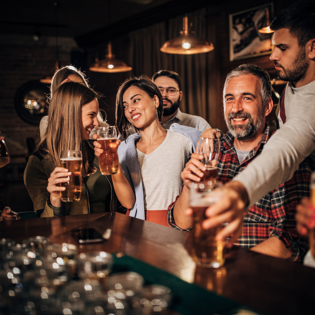 Bar group friends drinking dating attraction male female beer glass